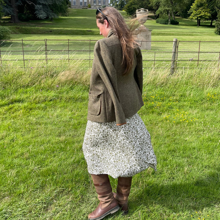 Square image of Bonnie Baker in a tweed jacket dress and sunglasses at the Game Fair event in Ragley Hall.//© Bonnie Baker