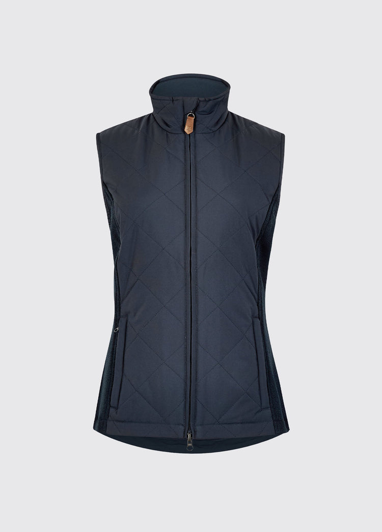 Navy womens quilted vest with a high collar, full zip front, diamond quilting and stretch knit side panels for warmth and comfort